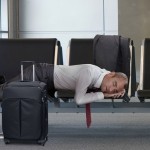 ManSleepingAtAirport